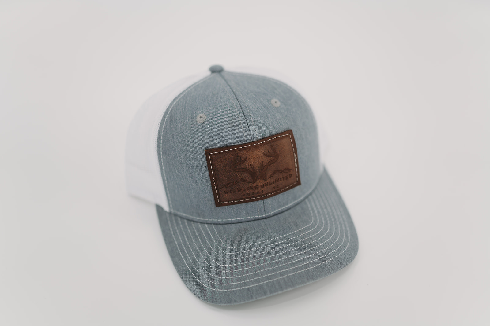 Wildlife Unlimited Leather Patch Trucker Hat
